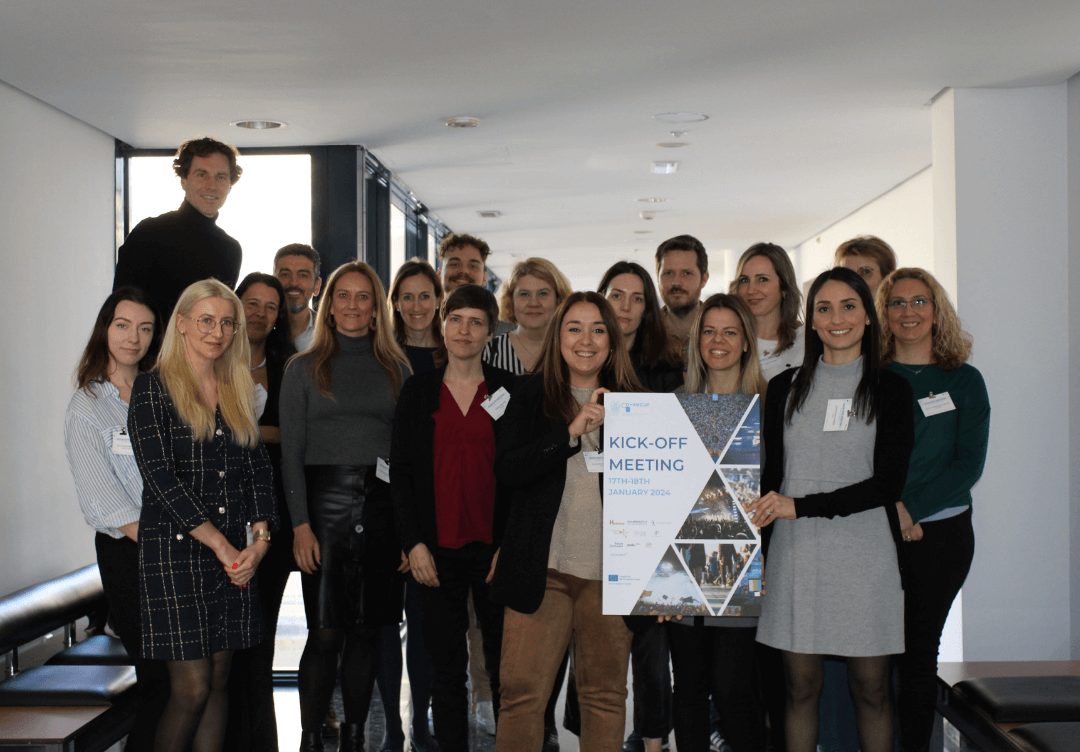 Group of 18 people from the cosecur team holding a sign.